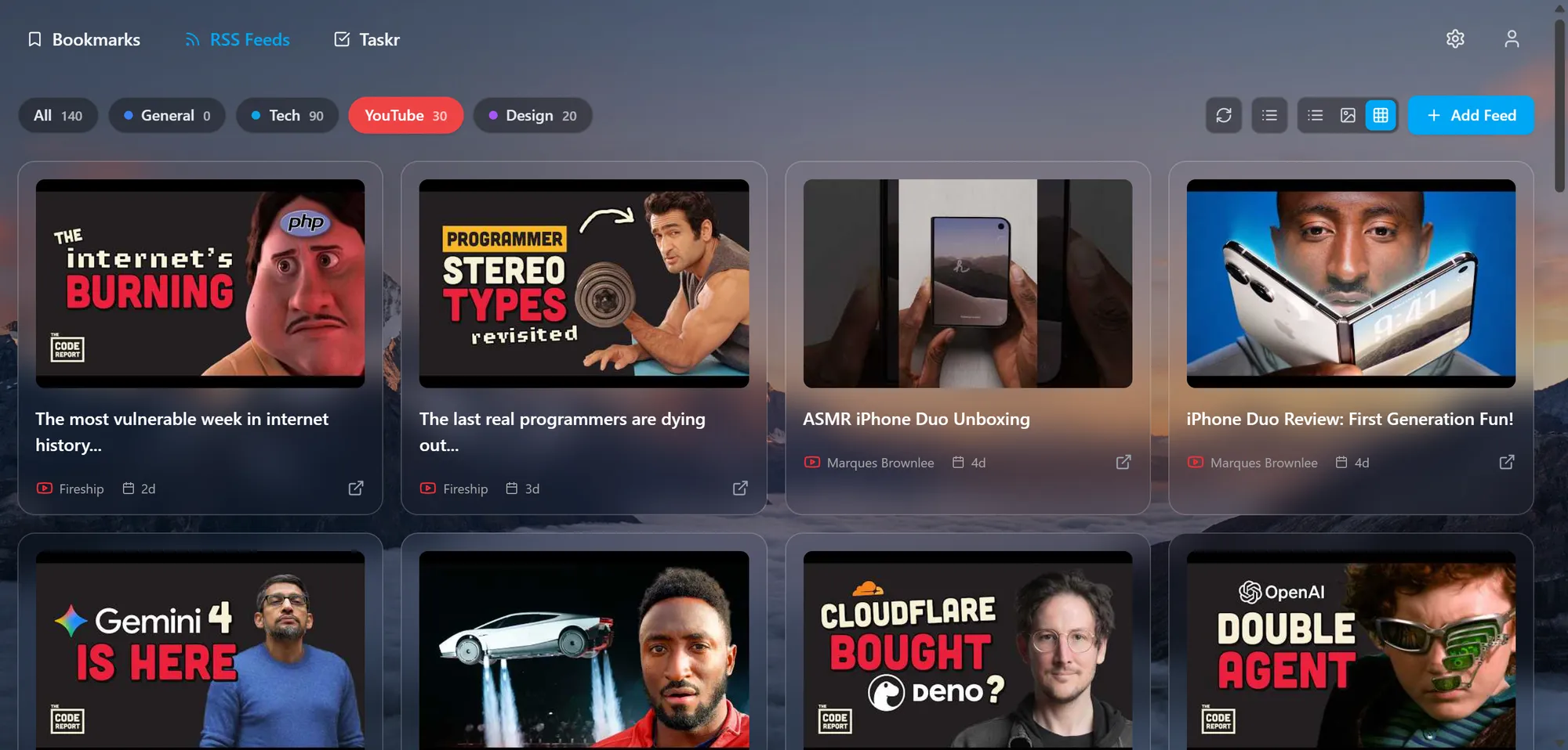 Deskr RSS reader showing the YouTube category as cards with video thumbnails from Fireship and Marques Brownlee